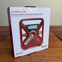 Front of sealed retail box showing FRX3+ radio image and branding