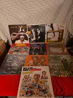 Full group shot of all 10 record jackets spread on table