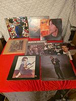 All nine vinyl record albums laid out showing front covers
