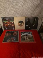 All five Seals & Crofts LPs laid out on red surface showing front covers
