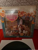 Front cover of Strawberry Alarm Clock Incense And Peppermints LP in shrink wrap with record partly visible