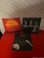 Three Utopia album covers arranged: Ra, Deface The Music, Adventures In Utopia