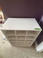 Top view of white cubby shelf showing surface condition