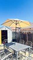 Full view of umbrella installed in patio set
