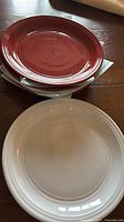 stack showing red and white plates together