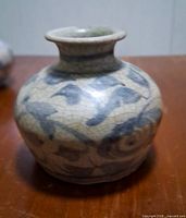 Front view of blue & white jarlet showing floral motifs and crackled glaze