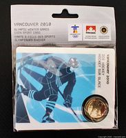 front view of sealed Vancouver 2010 coin card showing hockey graphic and coin