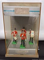 Front view of four Britains Middlesex Regiment figures in display case