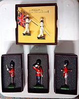 Open boxes showing two Devonshire Regiment figures and three Guards figures in foam