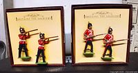 Open boxes showing two painted metal soldiers in each Sherwood Foresters set