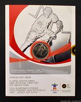 Front of numbered First Day card with 25-cent coin inset