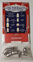 Front of sealed package showing card, booklet, and seven bullet replicas