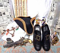 All items group view showing hat, shoes, shirt, suspenders, pistol, figurines, moustache pack, rolled newspapers