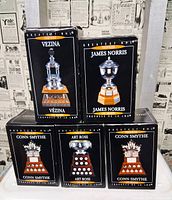 Front view of five boxed NHL trophy replicas