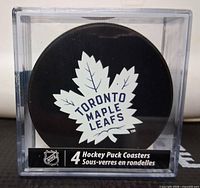 Front of boxed coasters showing Toronto Maple Leafs logo and quantity