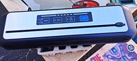 Top view showing Inkbird vacuum sealer control panel and body