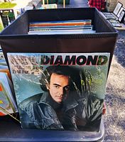 Front cover of Neil Diamond Headed for the Future LP in shrink atop stack of records