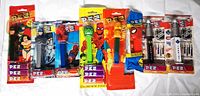 All nine sealed PEZ dispensers displayed side by side in original packaging