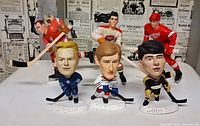 Front view of all six hockey figures with names visible on Headliners bases