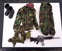 Full layout of uniform pieces, beret, boots, web gear, rifle