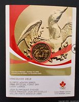 Front of numbered first-day card showing reverse loon design and Olympic branding