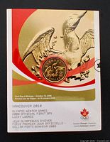 Front of numbered presentation card showing coin and Vancouver 2010 graphics