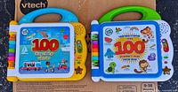 Front covers of both interactive books showing handles, speakers and buttons