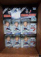 Front view of six sealed Wayne Gretzky Headliners figures in box