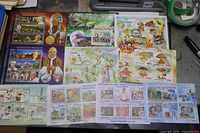 Overall view showing multiple souvenir sheets arranged on table