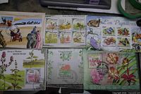 Multiple souvenir sheets showing medicinal plants, butterflies, orchids, environment and horse transport