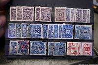 First stock card showing purple Postage Due and blue Excise War Tax stamps