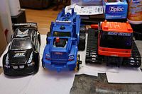 three toy vehicles side by side