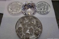 Group shot of three flower frogs and faceted glass diamond