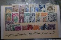 Front view of stock card with Nigeria, Réunion, Mauritius, Swaziland stamps