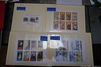 Folder page showing four souvenir sheets including insect and illustrated art themes