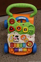 Full view of VTech walker showing handle, wheels and activity panel