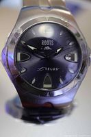 Front view of Roots Telus watch showing dial and branding