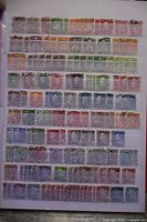 Full view of stock sheet displaying multiple rows of used stamps
