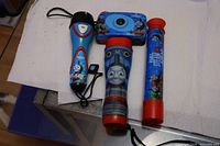Group shot of Thomas & Friends camera, two flashlights, telescope