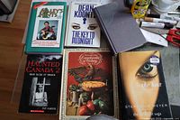 Group of six books and journal laid out