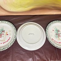 Three plates front and back view on table