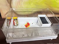 Overall view of acrylic turtle habitat and included accessories