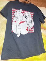 Front view showing full anime graphic on black T-shirt