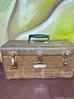 Front view showing full toolbox with handle and latches