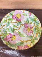 Top view of saucer showing Desert Rose floral pattern