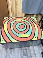 Top view showing multicolour concentric spiral design on lid