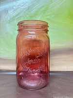 Front view of pink Jardin embossed mason jar