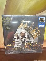 Front cover showing sealed album with Walmart Exclusive sticker