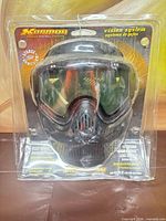Front view of sealed Karmor Vision System paintball mask in blister packaging
