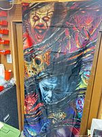 Full view of tapestry hanging, showing overall size and character collage